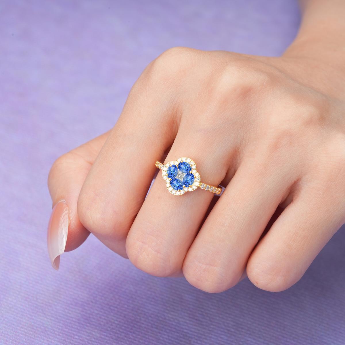 Unique Flower-Shaped 4-Prong Oval Cut Sapphire Engagement Ring