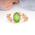 Nature Inspired Oval Cut Four Prong Leaf Vine Accent Peridot Engagement Ring - Additional view
