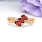Luxurious Intertwined 4-Prong Oval Cut Garnet Three-Stone Wedding Ring - Additional view