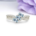 Luxurious Intertwined 4-Prong Oval Cut Aquamarine Three-Stone Wedding Ring - Additional view