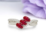 Luxurious Intertwined 4-Prong Oval Cut Ruby Three-Stone Wedding Ring - Additional view