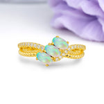 Luxurious Intertwined 4-Prong Oval Cut Fire Opal Three-Stone Wedding Ring - Additional view