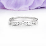 Half Channel Set Graduated Center Large Round Cut Moissanite Wedding Ring - Additional view