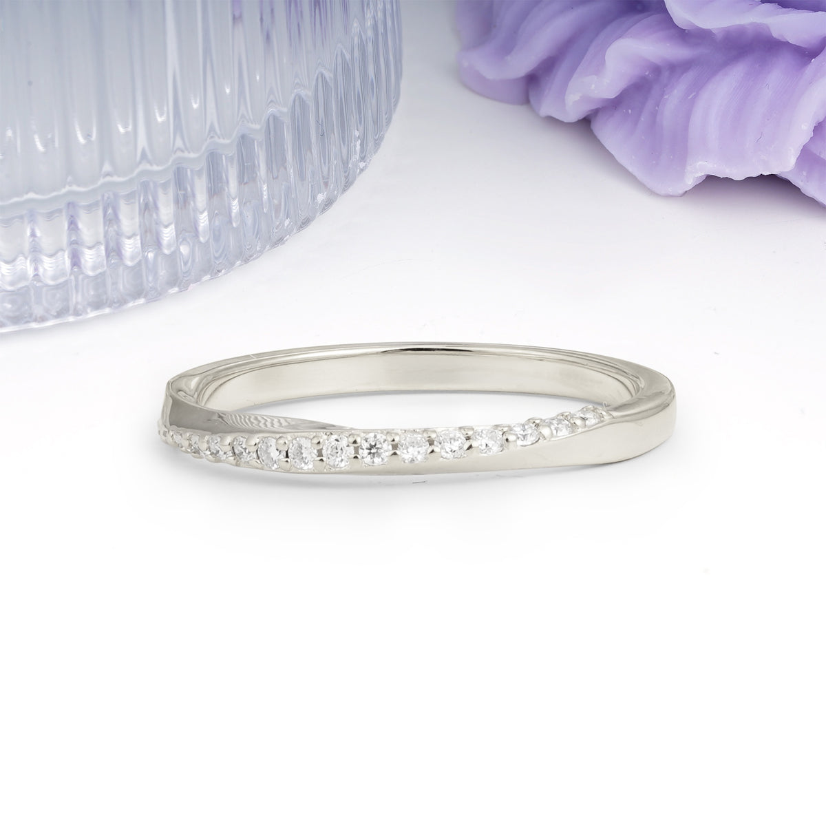 Soft Glossy Twisted Contour Half Way Channel Inlaid Tiny Gem Round Cut Moissanite Wedding Ring - Additional view