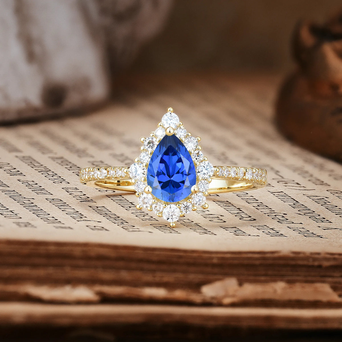 Classic Pavé-Set, Luxurious 3-Prong Pear-Cut Sapphire Engagement Ring