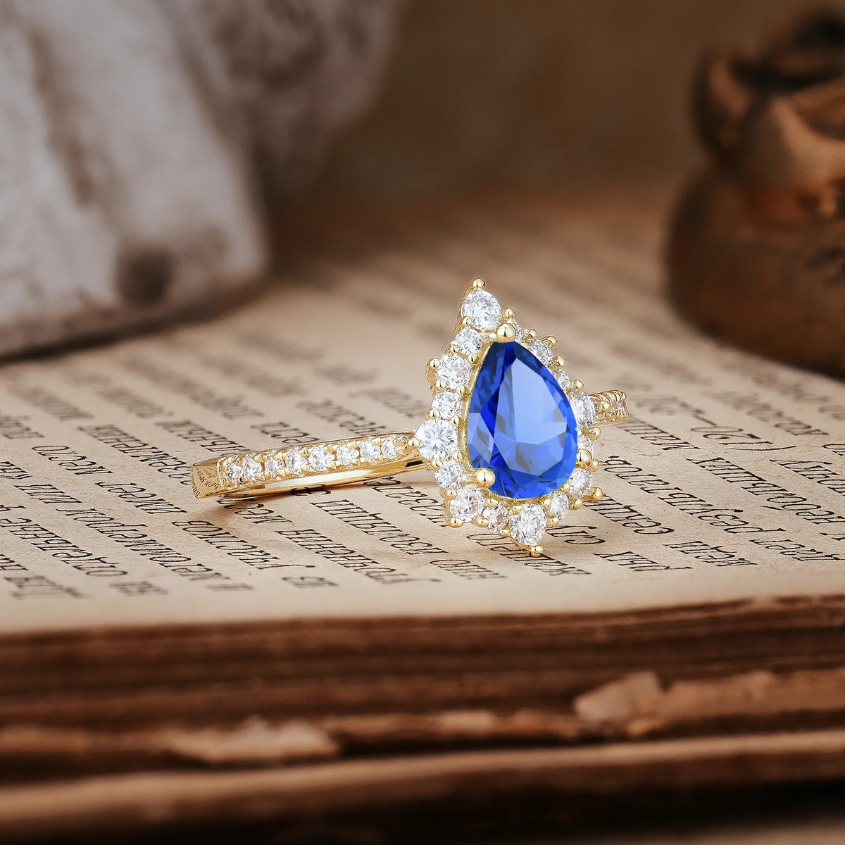 Classic Pavé-Set, Luxurious 3-Prong Pear-Cut Sapphire Engagement Ring