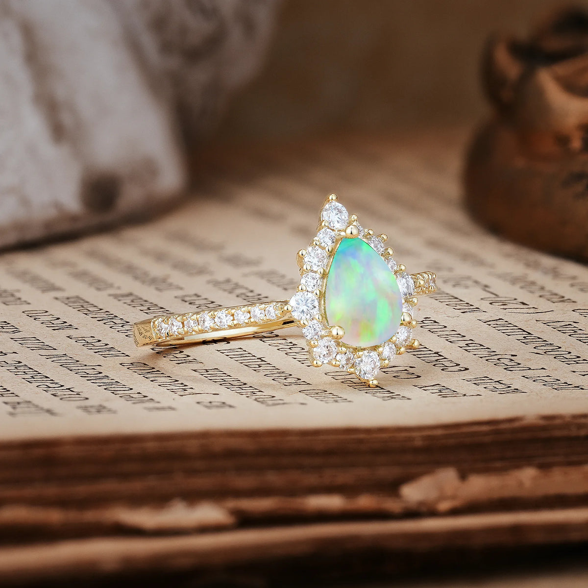 Classic Pavé-Set, Luxurious 3-Prong Pear-Cut Fire Opal Engagement Ring