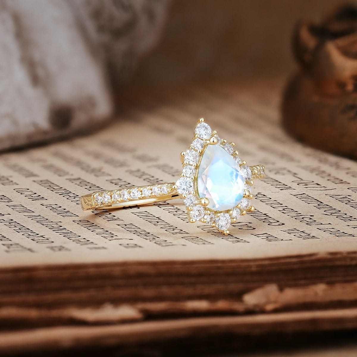 Classic Pavé-Set, Luxurious 3-Prong Pear-Cut Moonstone Engagement Ring