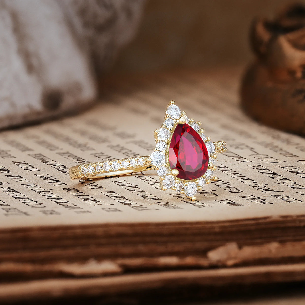 Classic Pavé-Set, Luxurious 3-Prong Pear-Cut Ruby Engagement Ring