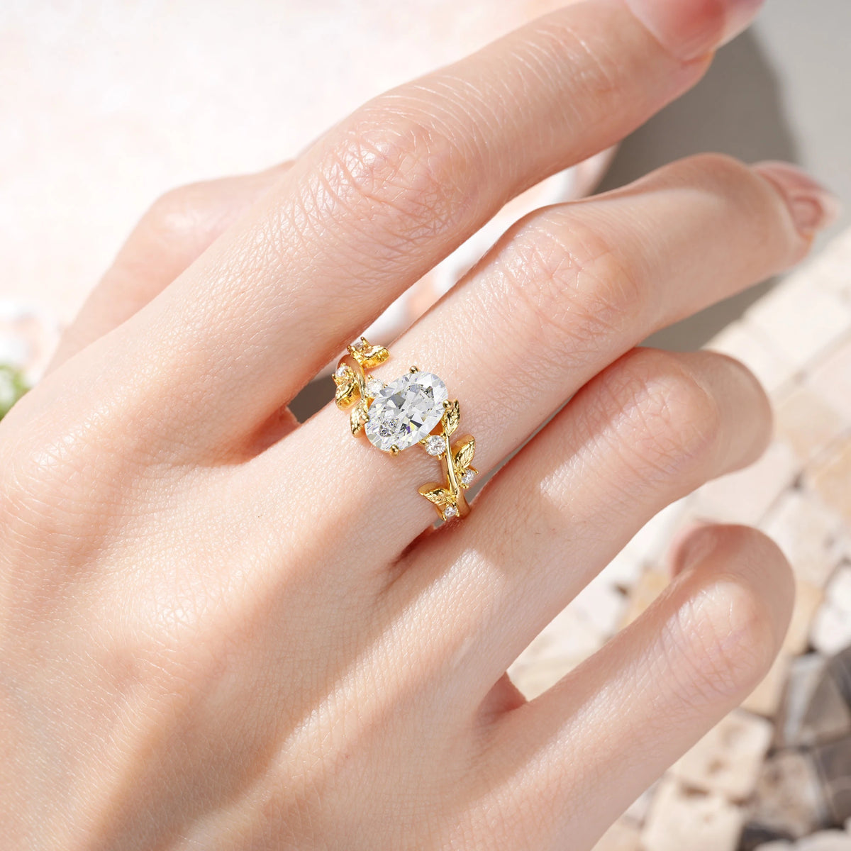 Oval Cut Moissanite Nature Inspired Four Prong Leaf Vine Accent Engagement Ring