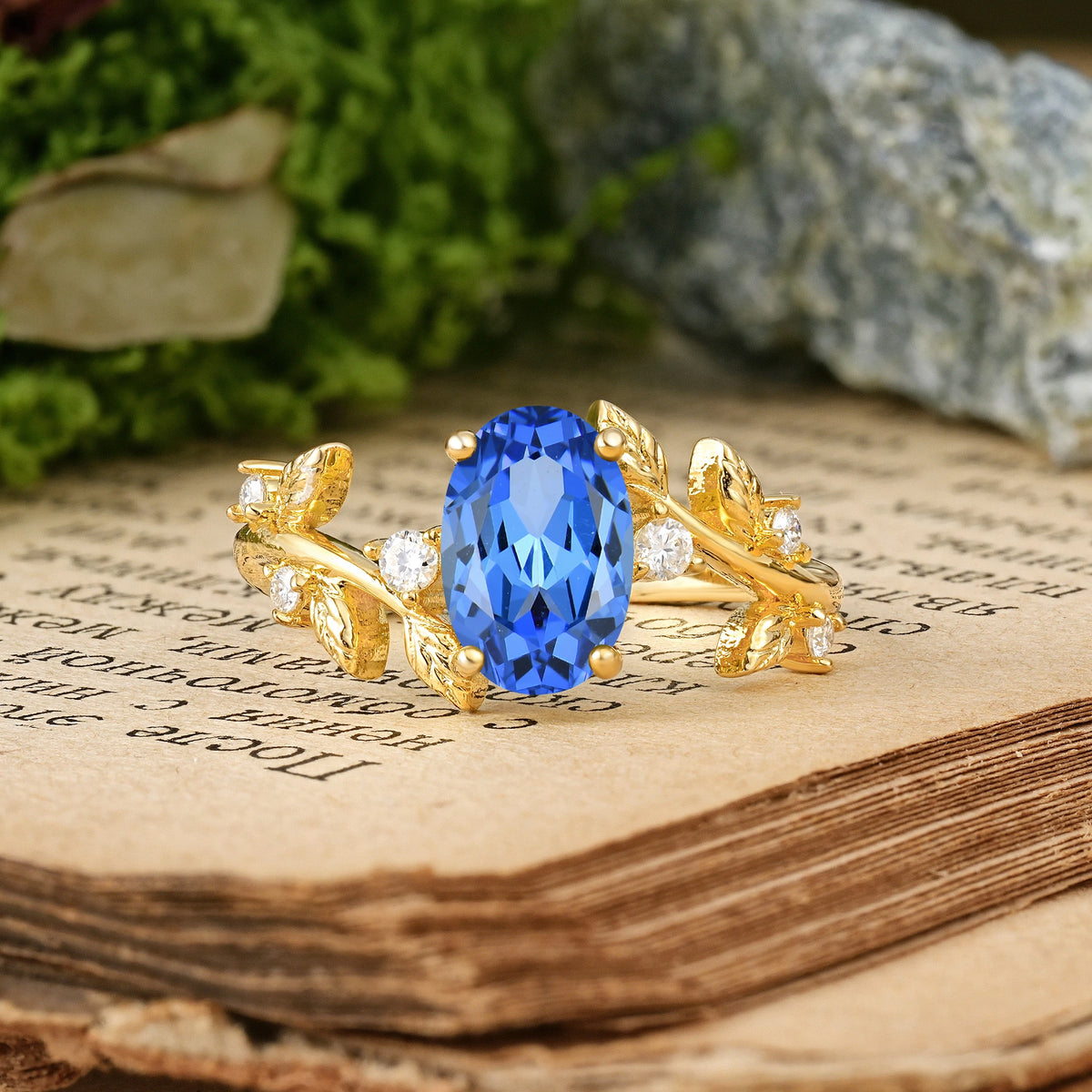 Oval Cut Sapphire Nature Inspired Four Prong Leaf Vine Accent Engagement Ring