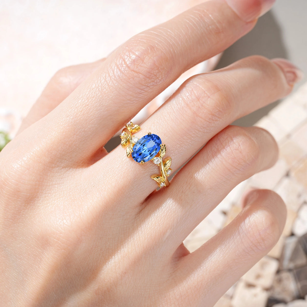 Oval Cut Sapphire Nature Inspired Four Prong Leaf Vine Accent Engagement Ring