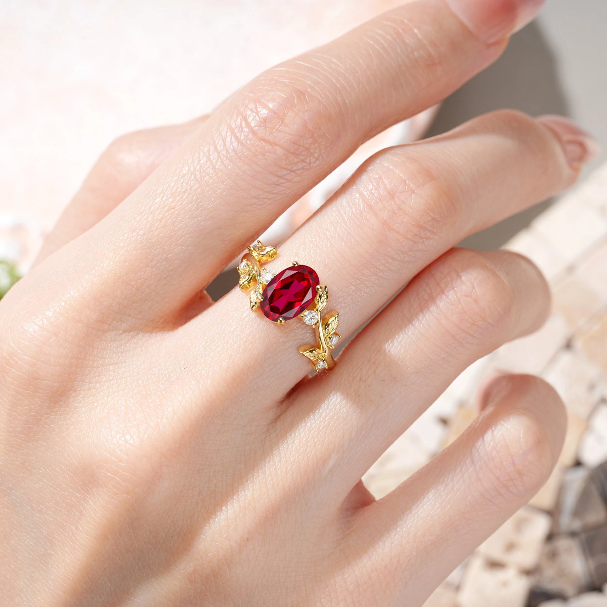 Oval Cut Ruby Nature Inspired Four Prong Leaf Vine Accent Engagement Ring