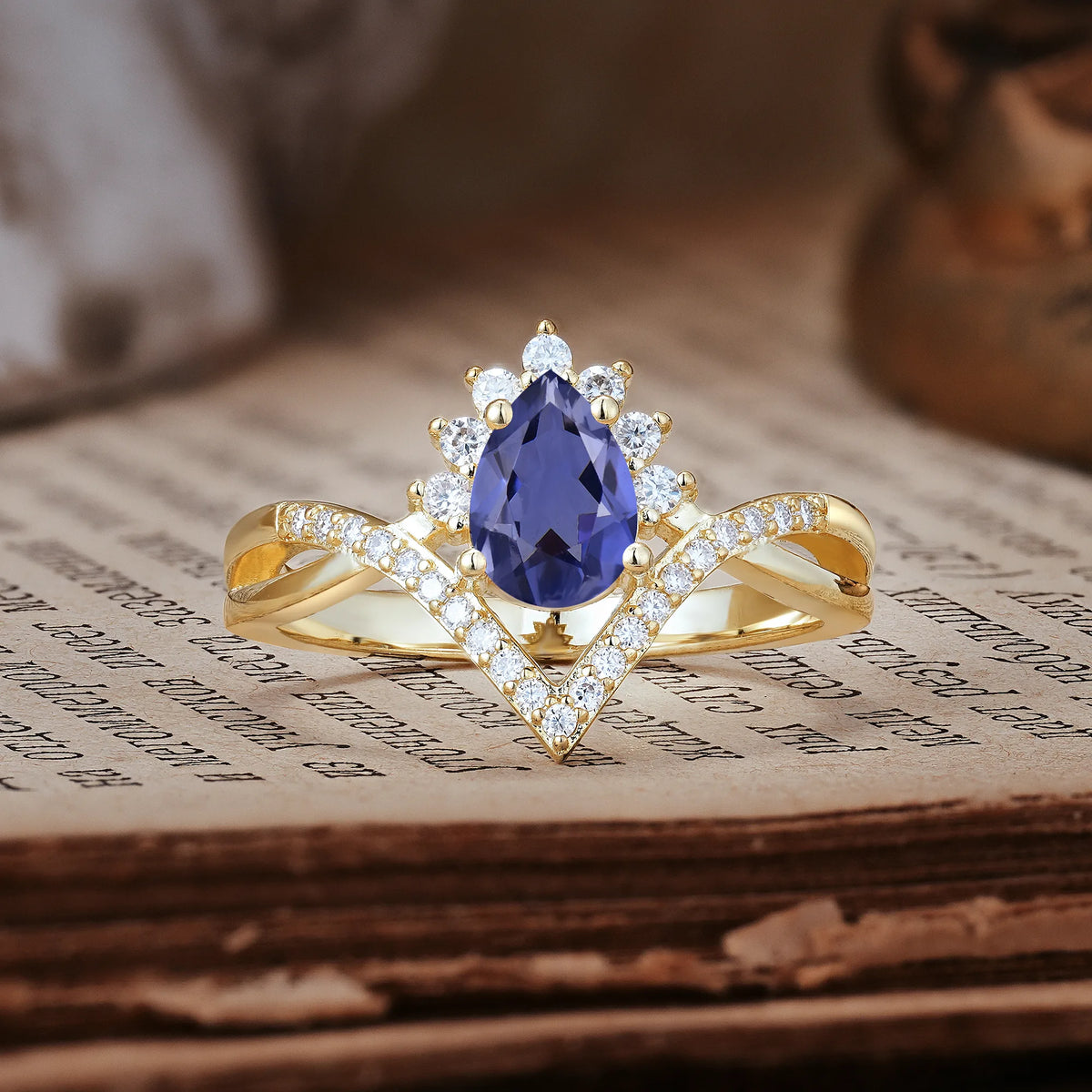Princess Crown Pear Cut Halo V Shaped Twisted Pavé Shank Tanzanite Engagement Ring