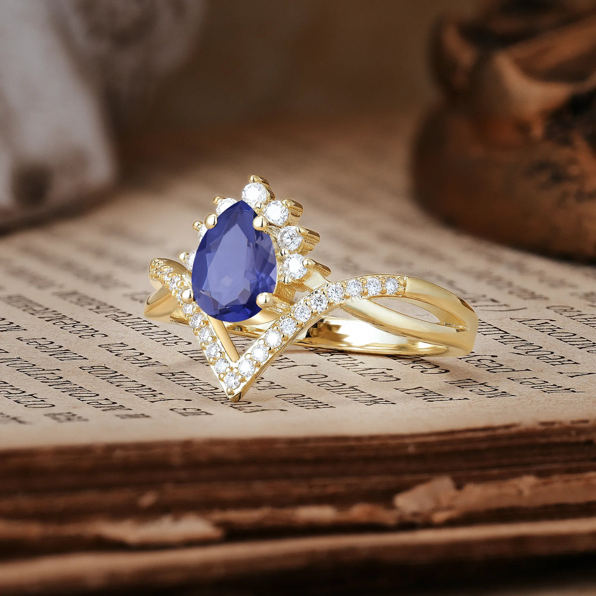 Princess Crown Pear Cut Halo V Shaped Twisted Pavé Shank Tanzanite Engagement Ring