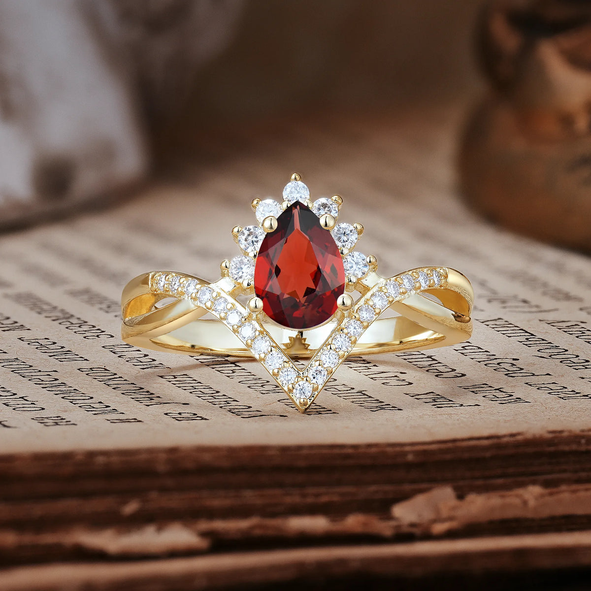 Princess Crown Pear Cut Halo V Shaped Twisted Pavé Shank Garnet Engagement Ring
