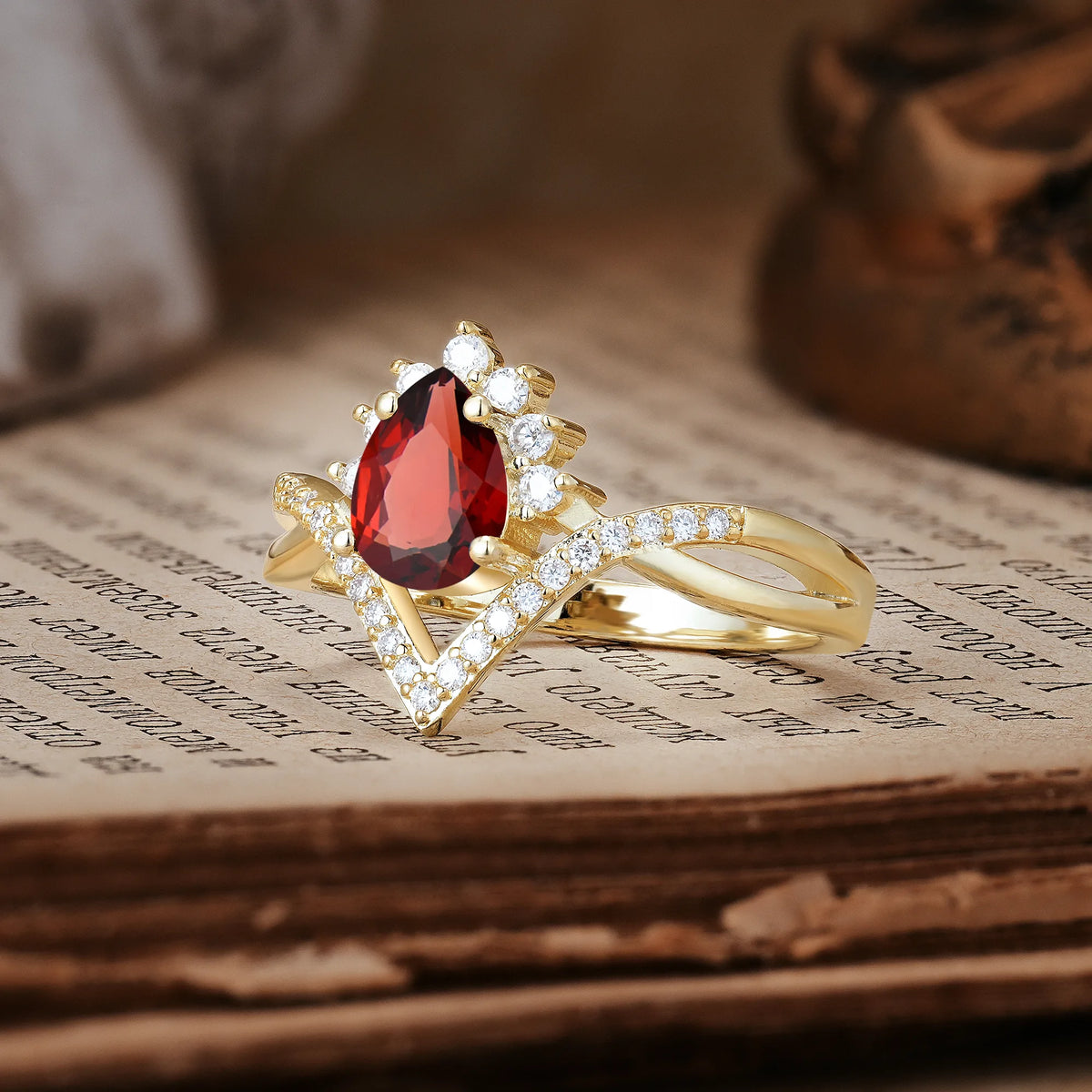 Princess Crown Pear Cut Halo V Shaped Twisted Pavé Shank Garnet Engagement Ring