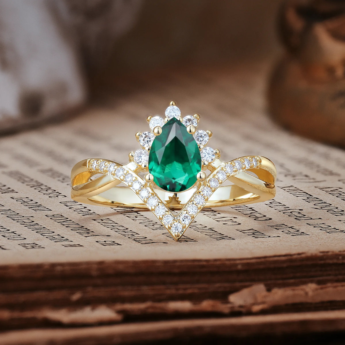 Princess Crown Pear Cut Halo V Shaped Twisted Pavé Shank Emerald Engagement Ring