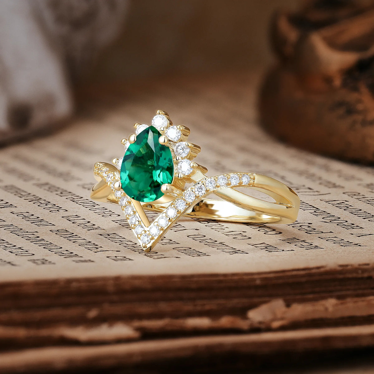 Princess Crown Pear Cut Halo V Shaped Twisted Pavé Shank Emerald Engagement Ring