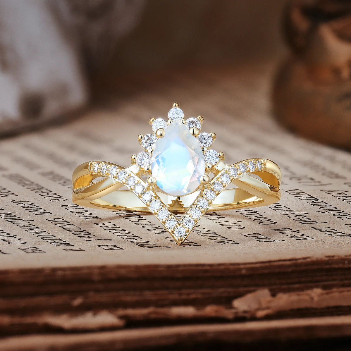 Princess Crown Pear Cut Halo V Shaped Twisted Pavé Shank Moonstone Engagement Ring