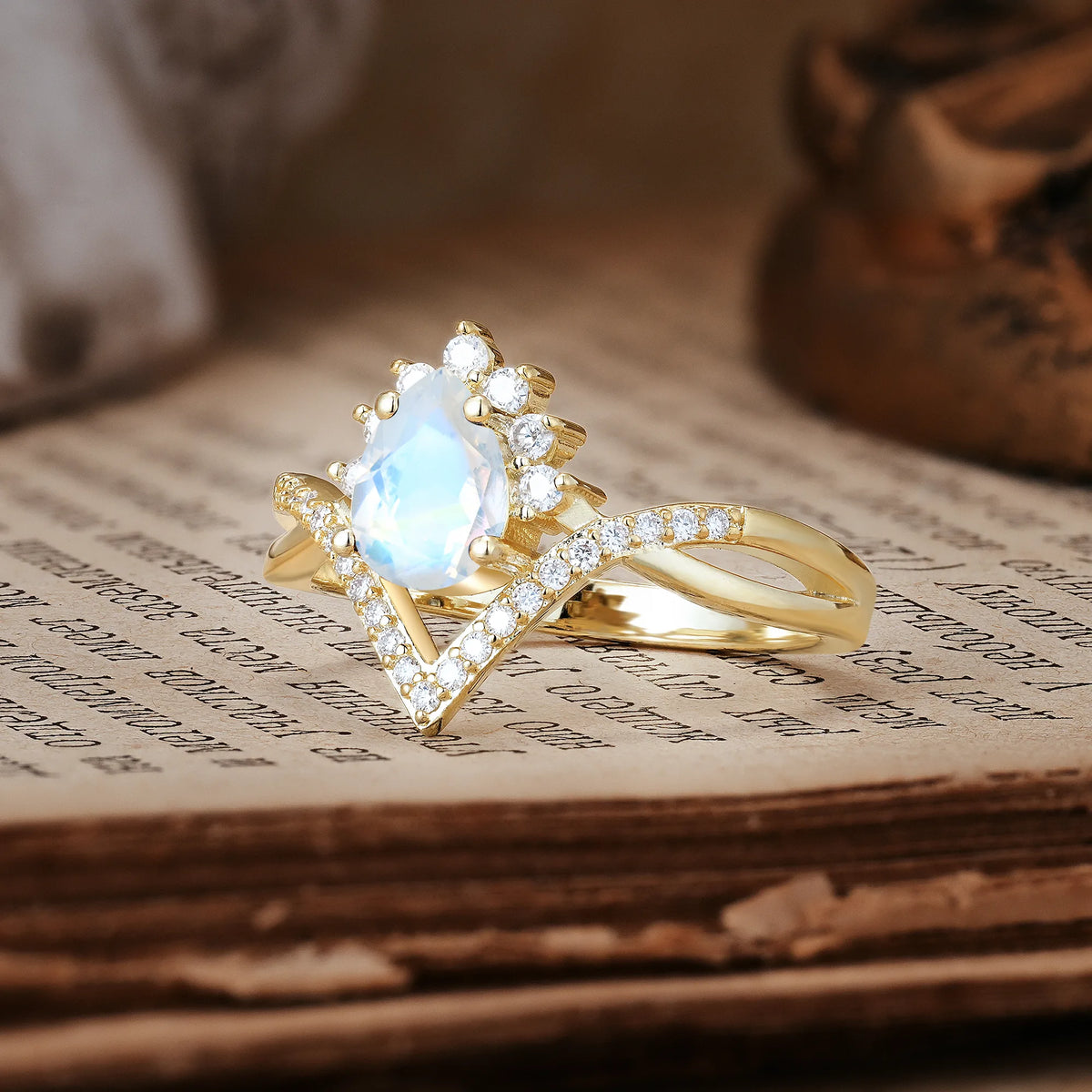 Princess Crown Pear Cut Halo V Shaped Twisted Pavé Shank Moonstone Engagement Ring