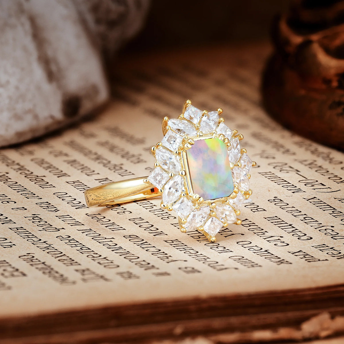 Unique & Classic 12-Prong Emerald Cut Fire Opal Engagement Ring