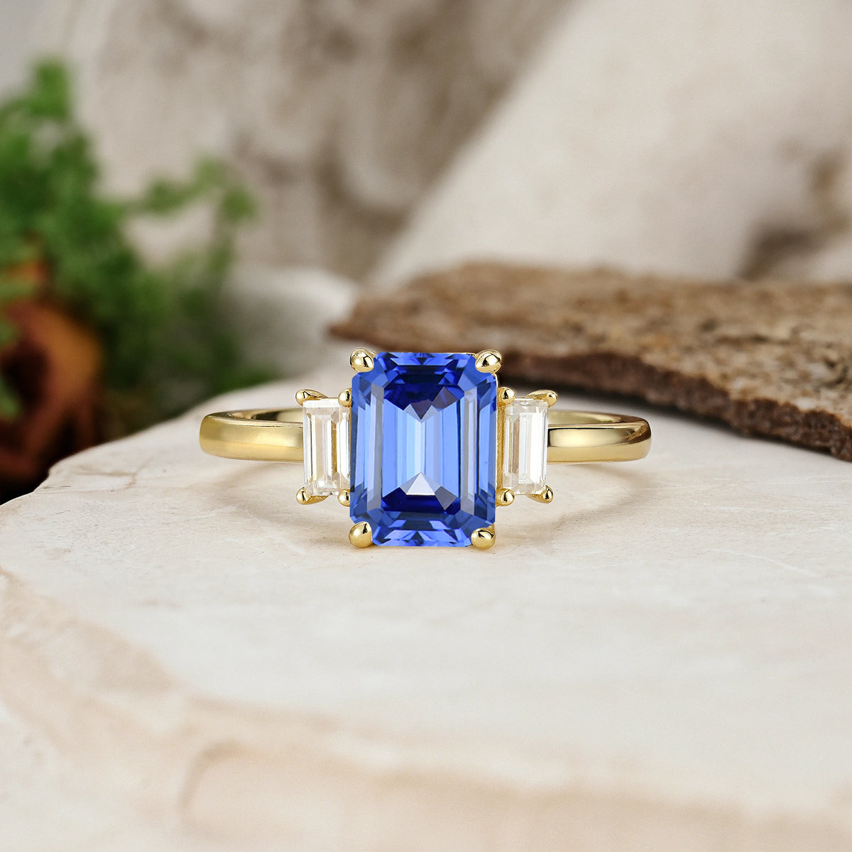 Emerald Cut Sapphire Three Stone Engagement Ring with Trapezoid Side Stones