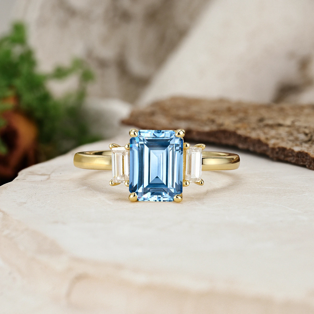 Emerald Cut Aquamarine Three Stone Engagement Ring with Trapezoid Side Stones