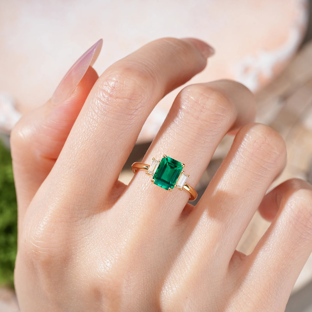 Emerald Cut Emerald Three Stone Engagement Ring with Trapezoid Side Stones