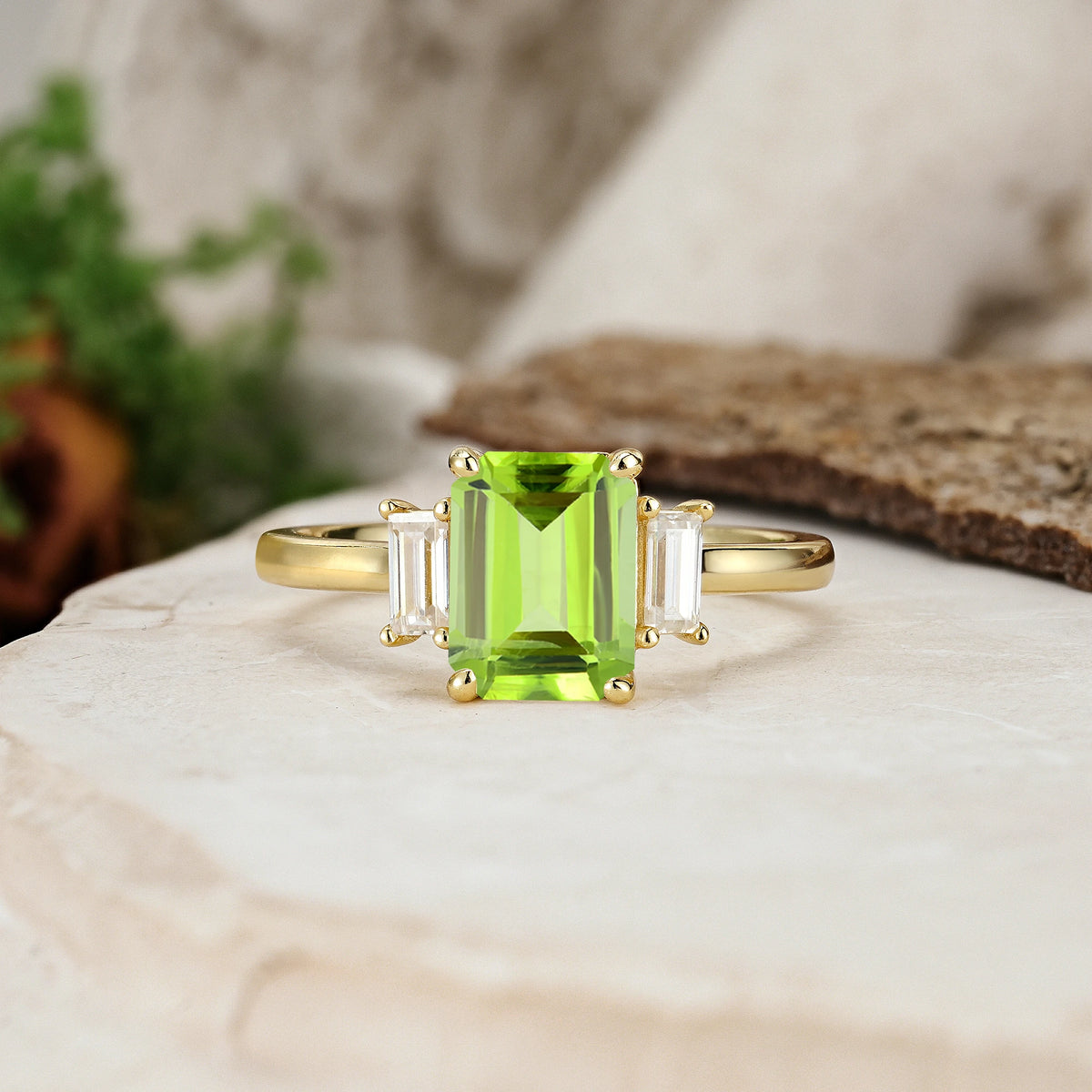 Emerald Cut Peridot Three Stone Engagement Ring with Trapezoid Side Stones