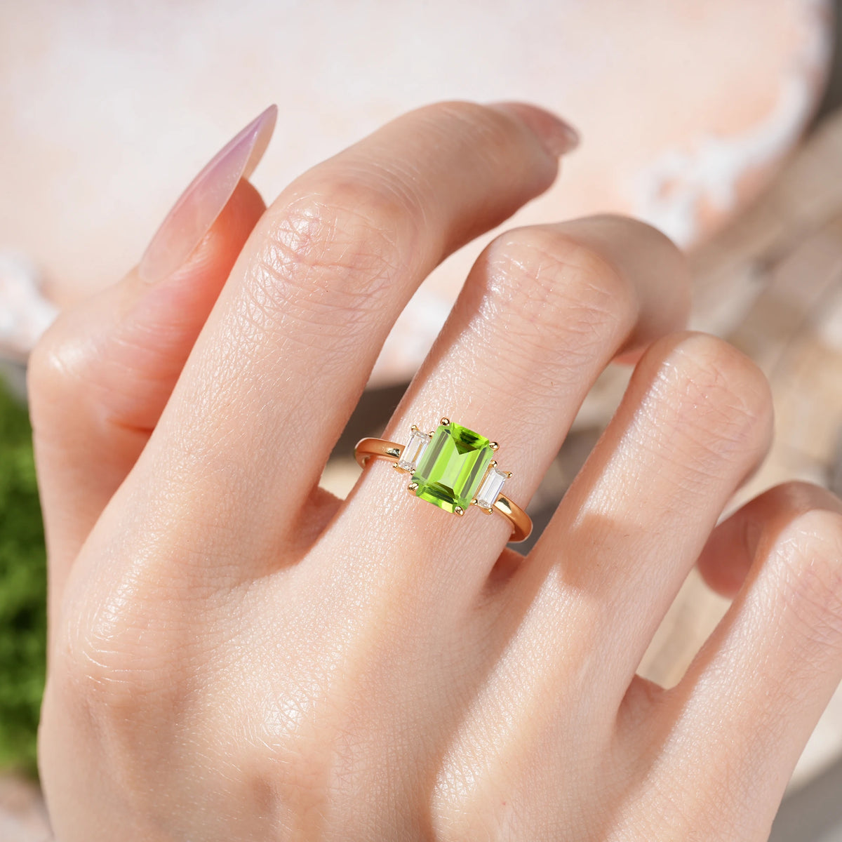 Emerald Cut Peridot Three Stone Engagement Ring with Trapezoid Side Stones