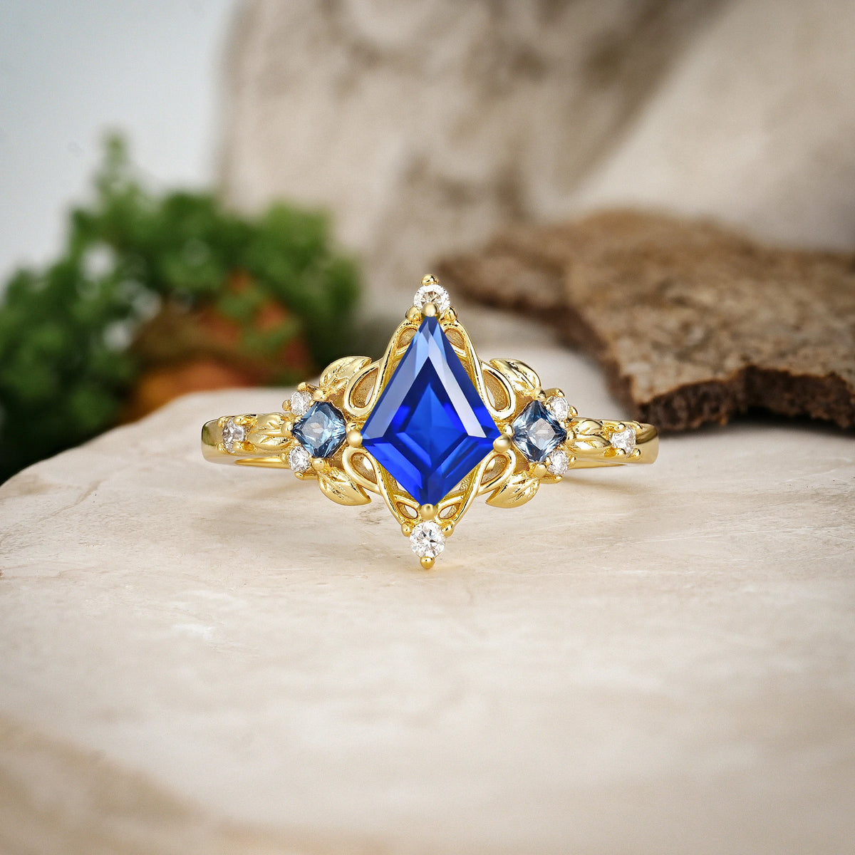 Kite Cut Sapphire Art Nouveau Leaf Engagement Ring with Princess Side Stones