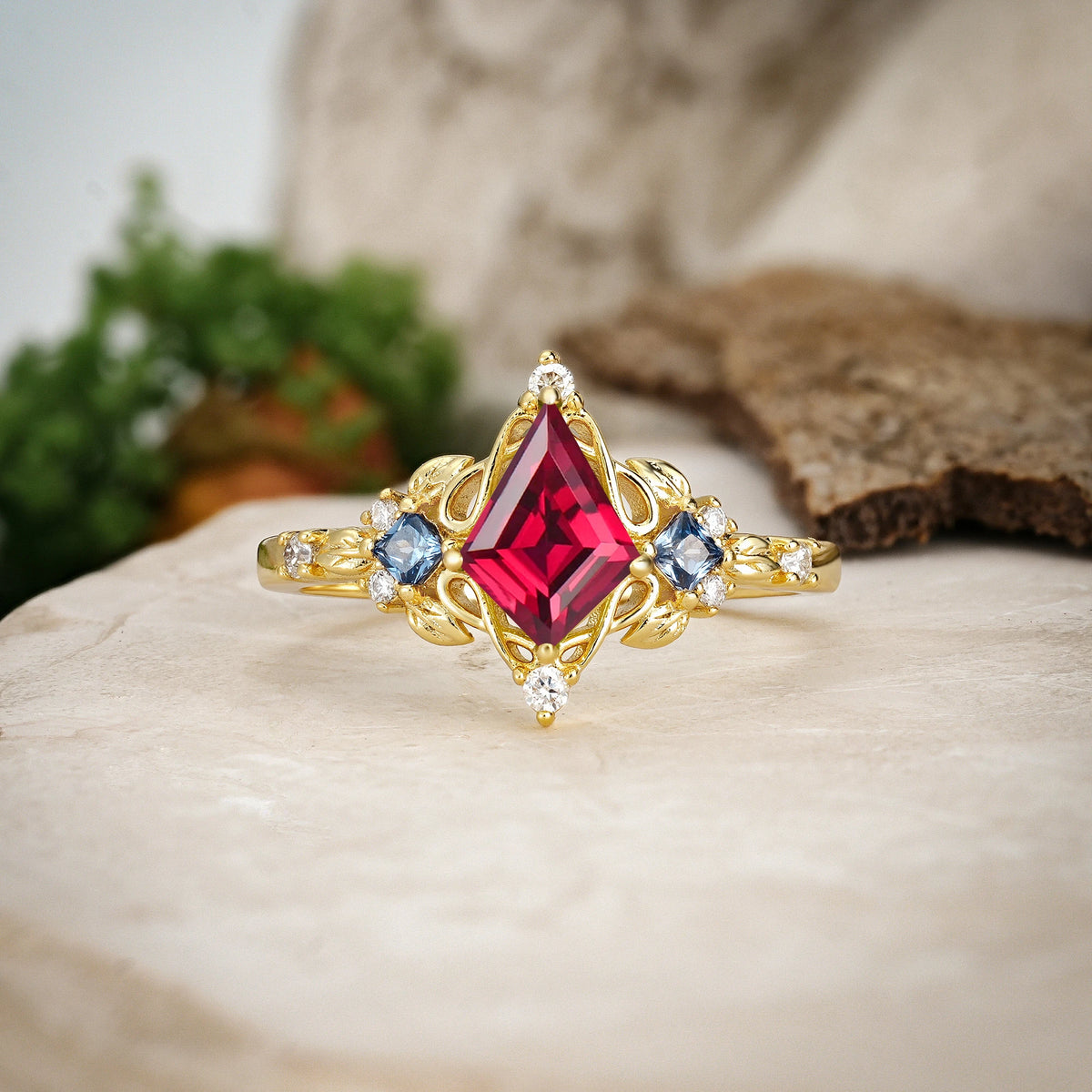 Kite Cut Ruby Art Nouveau Leaf Engagement Ring with Princess Side Stones