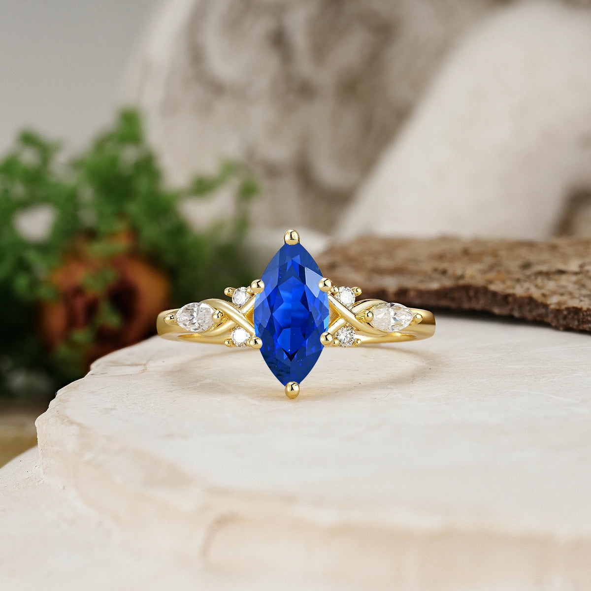 Marquise Cut Sapphire Twisted Bypass Engagement Ring with Pear Side Stones